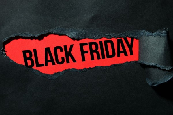 Ripped black paper revealing black friday
