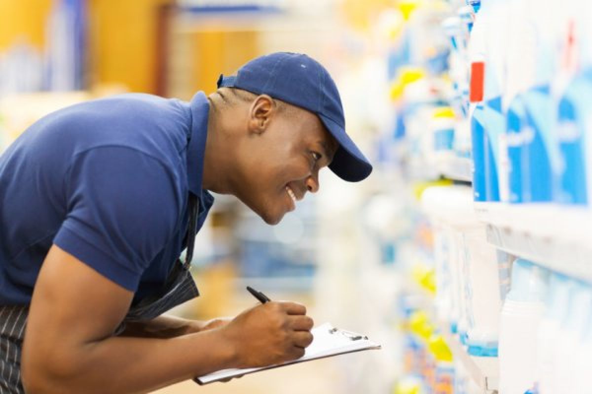 Man doing inventory in a storage facility