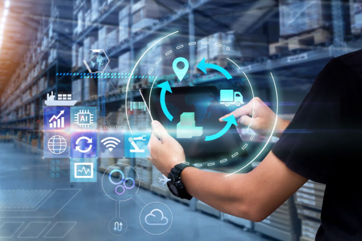 Man hands using tablet on blurred warehouse as background