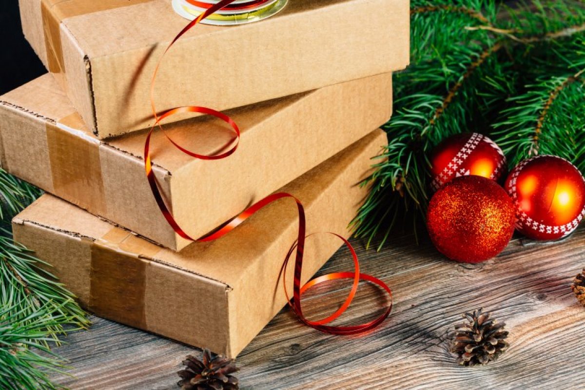 Picture of boxes beside Christmas ornaments